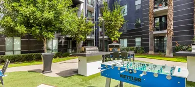 a ping pong table in front of a building at Noho Haven 2 bed Apt with FREE Parking in North Hollywood
