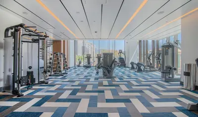a gym with a view of the city at Modern 1BR Apartment with Pool, Hot Tub and Gym Access 10mins to Universal Studios in Los Angeles