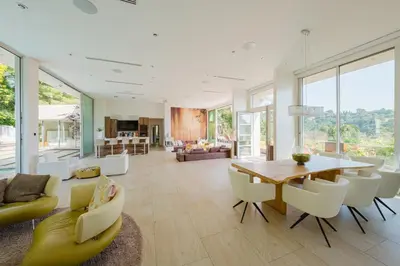 a living room with a wooden table and chairs at Zen Estate in Los Angeles