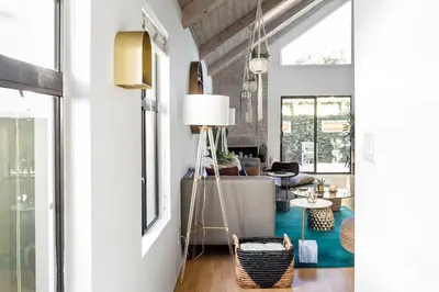 a living room with a couch and a table at Silver Triangle Oasis with Verdant Backyard in Los Angeles