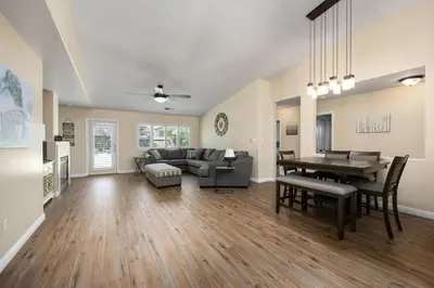 a living room with a couch and a table at Relaxing 4BR 2BA Sleeps 8 Family Friendly in Bakersfield