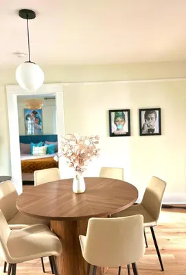 a dining room with a wooden table and chairs at Cozy Hollywood Cottage - Walk to Larchmont Village in Los Angeles