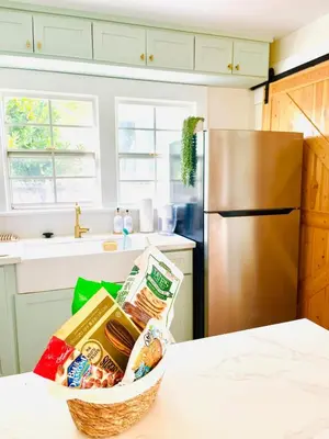 a basket of food sitting on a counter in a kitchen at Cozy Hollywood Cottage - Walk to Larchmont Village in Los Angeles