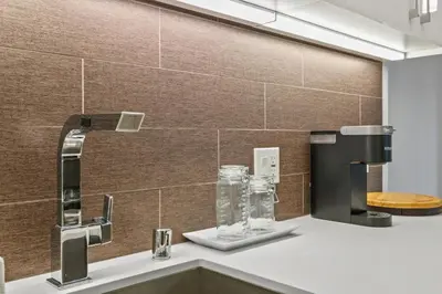 a kitchen with a sink with a water fountain at Stunning DTLA Gem 2 bed with pool, gym and parking in Los Angeles