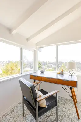 a home office with a desk and a chair at Serene & beautiful bohemian hilltop retreat in Glendale