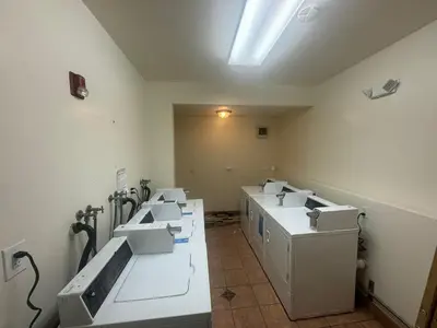 a room with a row of sinks in a room at Van Nuys Vibe in Van Nuys County Court Heliport