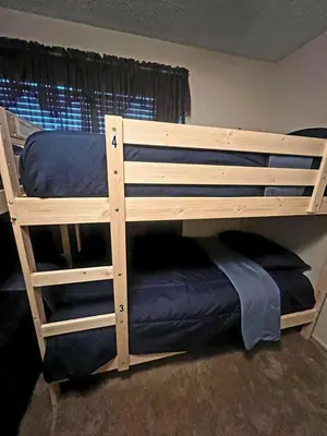 a wooden bunk bed in a room at Van Nuys Vibe in Van Nuys County Court Heliport