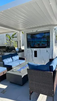 a living room with two couches and a tv at Wellness Villa Resort in Abbeyville