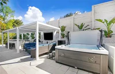 a hot tub on a patio with a gazebo at Wellness Villa Resort in Abbeyville