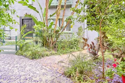 a house with a door and plants in front of it at Hollywood Deluxe Homestay in Los Angeles