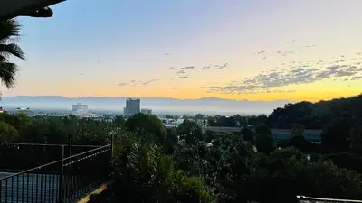 a view of a city at sunset at Glamping Cabin Tent Heated View Deck 2Acre Estate - Female Share Indoor - Men Share Outdoor - RG in Encino