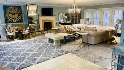 a living room with a couch and a fireplace at Glamping Cabin Tent Heated View Deck 2Acre Estate - Female Share Indoor - Men Share Outdoor - RG in Encino