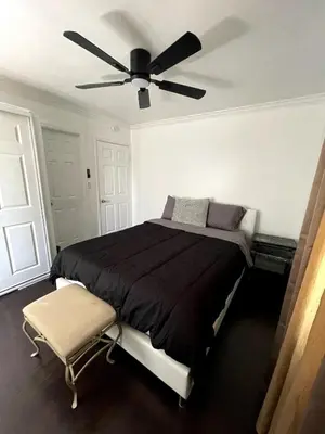 a bedroom with a bed with a ceiling fan at House in Redondo Beach 2 bedroom 1 bath in Redondo Beach