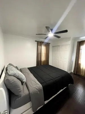 a bedroom with a bed and a ceiling fan at House in Redondo Beach 2 bedroom 1 bath in Redondo Beach