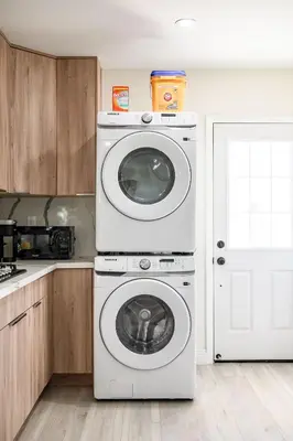 a white washer and dryer in a kitchen at Modern New 3B Home Fully Stocked & Cozy & Sunlight