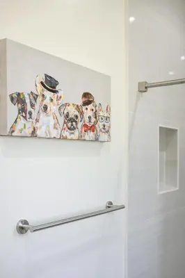 a painting of three dogs on a wall in a bathroom at Cozy Modern Home w Full Kitchen & Parking