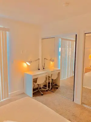 a bedroom with a desk and a mirror at Western Romaine in Los Angeles