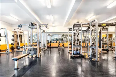 a gym with a lot of tread machines at Loft & Luxe Hollywood with FREE PARKING in Los Angeles