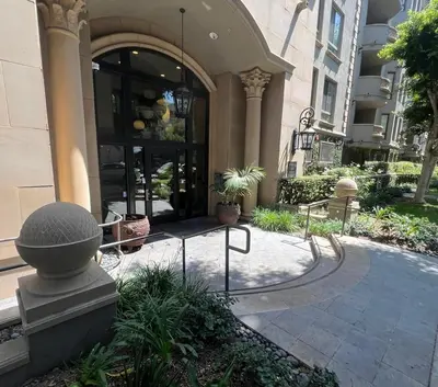 a building with a walkway in front of a building at LA Koreatown Nest House - Modern, Free Parking, Pool and Sauna, No Cleaning Fee in Los Angeles