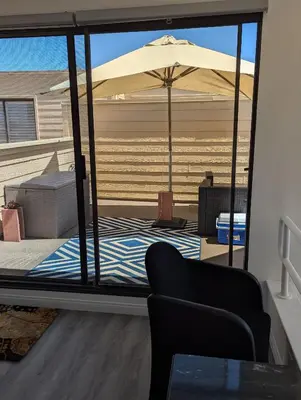 a view of a living room with an umbrella at 31 night required rental Waterfront penthouse 180 ocean view in Redondo Beach