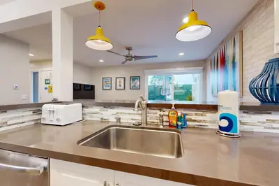 a kitchen with a sink and a counter top at On the Doorstep in Anaheim