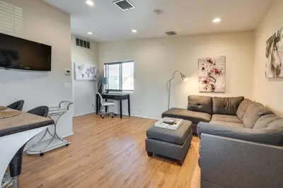 a living room with a couch and a table at 4 Mi to Beverly Hills Quiet LA Gem with Shared Yard in Los Angeles