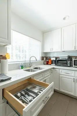 a kitchen with a sink with an open drawer at Ideal 4BR2BA Home for Family Vacations in Alhambra