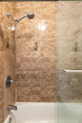 a bathroom with a shower with a glass door at Ideal 4BR2BA Home for Family Vacations in Alhambra