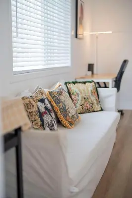 a white couch with pillows on it in a living room at Cozy 2BR2BA Guest House in Alhambra in Alhambra