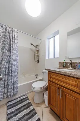a bathroom with a tub and a toilet and a sink at Amazing Berryman 1bd#8 in Los Angeles
