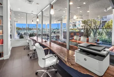 an office with a desk and chairs and a printer at Marina Escape 2BR Townhouse with FREE PARKING in Los Angeles