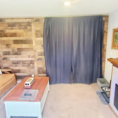 a living room with a couch and a table at Star Gazer's Paradise in Apple Valley