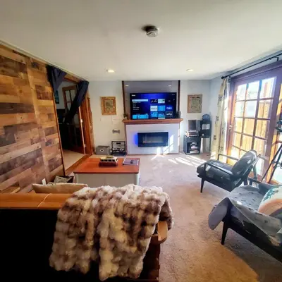 a living room with a couch and a fireplace at Star Gazer's Paradise in Apple Valley
