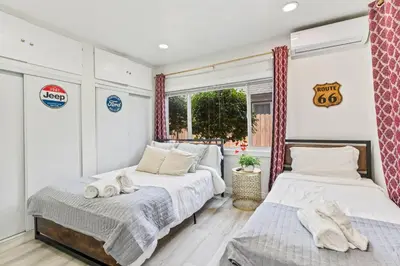 a bedroom with two beds and a window at Prime location King Bed! Private house1 in Alhambra