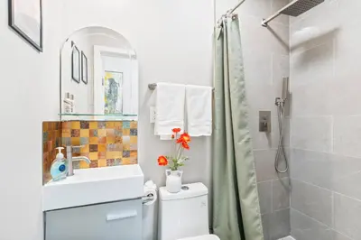 a bathroom with a shower and a toilet and a sink at Prime location King Bed! Private house1 in Alhambra