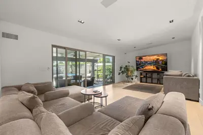 a large living room with a couch and a table at The Royer Retreat With Pool and Hot tub in Los Angeles