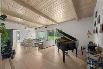 a living room with a piano and a couch at The Royer Retreat With Pool and Hot tub in Los Angeles