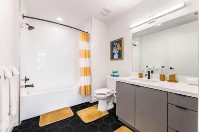 a bathroom with a sink and a toilet and a tub at Skyline Haven Near Dodger Stadium with Views in Los Angeles