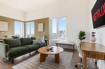 a living room with a couch and a table at Arts District Stay, Walk to Little Tokyo with Parking in Los Angeles