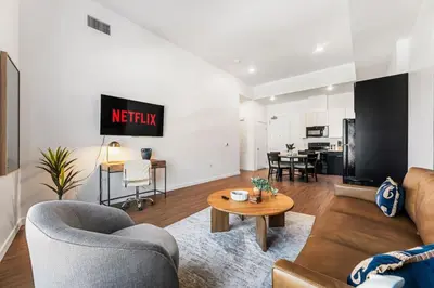 a living room with a couch and a table at Central LA Hideaway, Steps from Japanese Village in Los Angeles