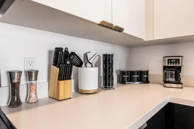 a kitchen counter with several utensils on it at Central LA Hideaway, Steps from Japanese Village in Los Angeles