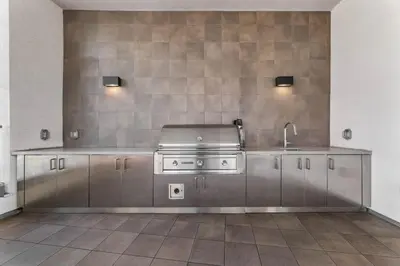 a kitchen with a stove and a sink at Stylish 2BD Haven with Scenic DTLA Views and Parking in Los Angeles