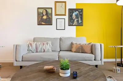 a living room with a couch and a table at Designer Stay in Arts District, Walk to Little Tokyo in Los Angeles