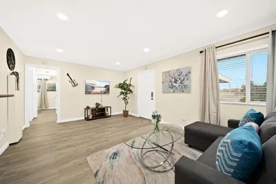 a living room with a couch and a glass table at Vibrant & Refreshing - 12 min to Downtown LA in Alhambra