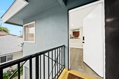 a balcony with a door leading to a kitchen at Vibrant & Refreshing - 12 min to Downtown LA in Alhambra