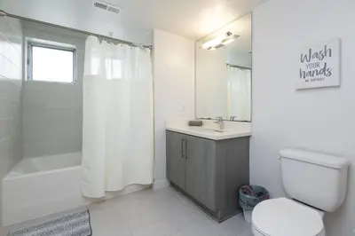 a bathroom with a toilet and a sink and a shower at Walk to Santa Monica Beach Pier Boardwalk Venice in Los Angeles