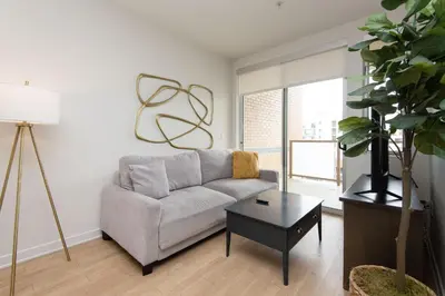 a living room with a couch and a table at Walk to Santa Monica Beach Pier Boardwalk Venice in Los Angeles