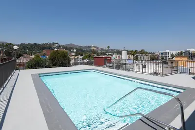 a swimming pool on the roof of a building at Stylish 2BR Apt with Rooftop Pool & Hollywood Views in Los Angeles