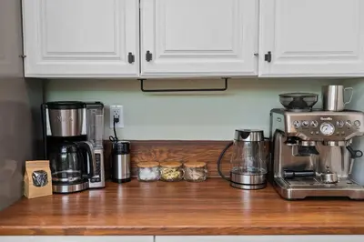 a kitchen counter top with a coffee maker and a coffee pot at New Listing Marina Villa by Colby & Conrad in Los Angeles