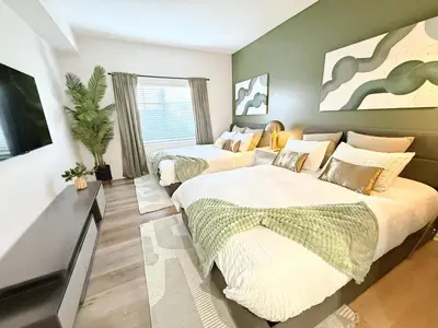 a bedroom with two beds and a large window at 3BR Retreat in Prime Valley Location 109 in Encino